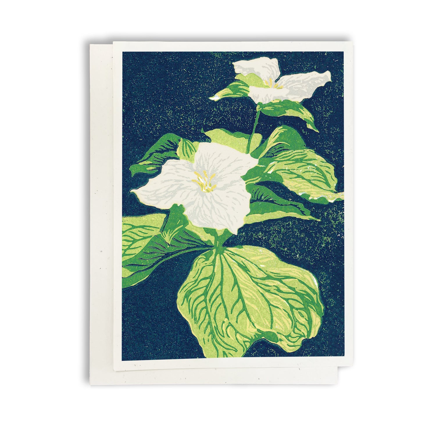 A blank A6 greeting card featuring a block print of two trillium flowers.