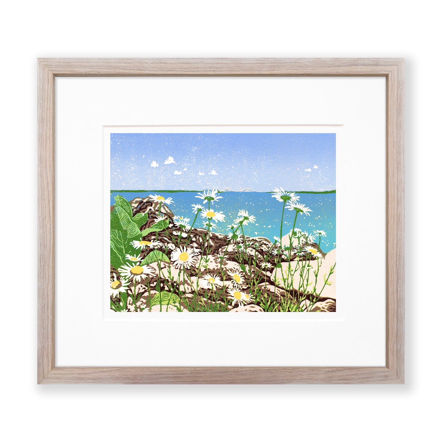 Daisy Shore is a 10" x 8" eight-color reduction block print by Natalia Wohletz of joyful daisies growing amongst limestone rocks on the Mackinac Island shore. Tucked back in the clear blue sky and turquoise water backdrop is the Mackinac Bridge. Matted in white and framed in a cerused oak frame.