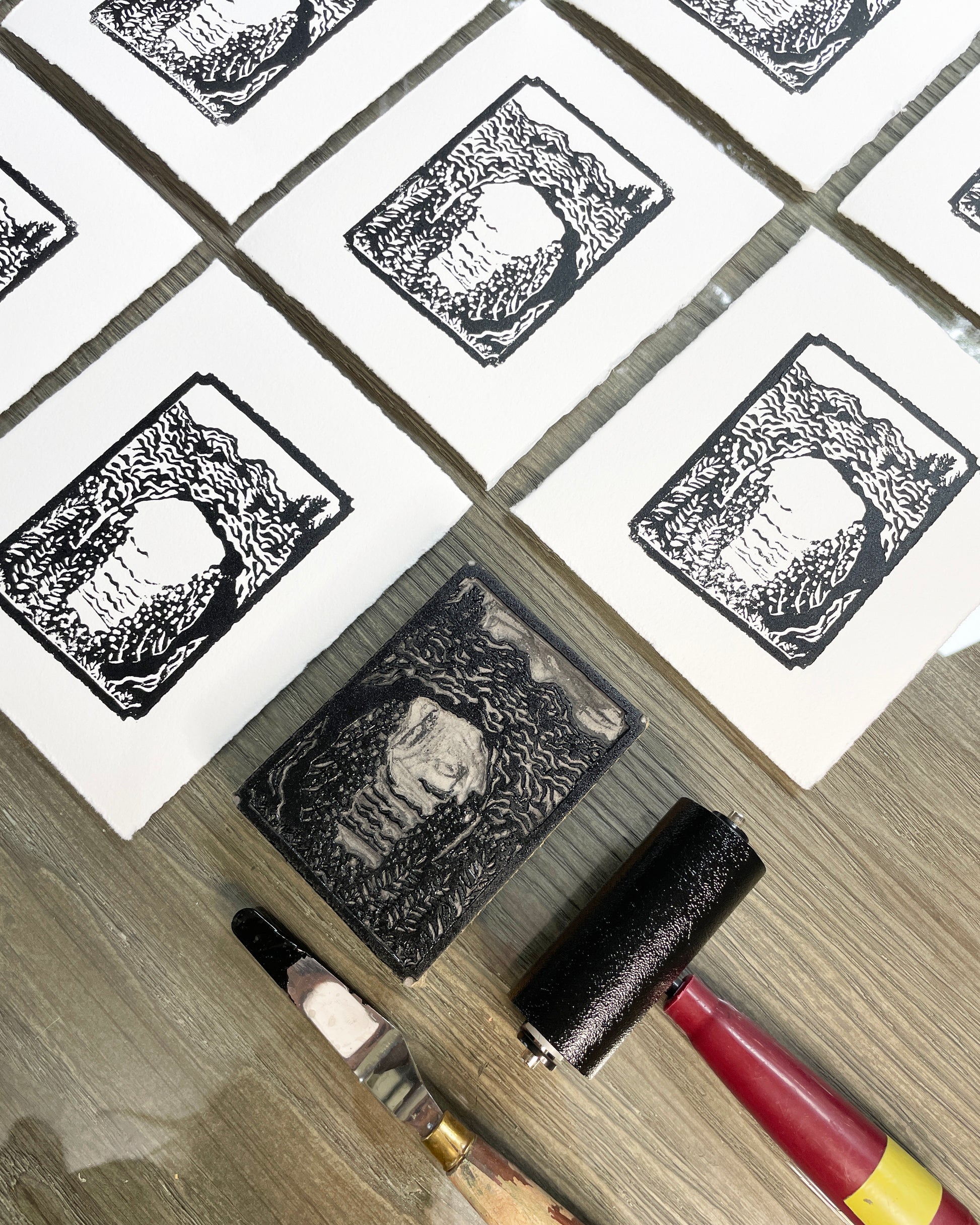 Carving and printing process behind the creation of "Mini Arch Rock", a 3"x4" one-color black and white block print of Arch Rock on Mackinac Island.