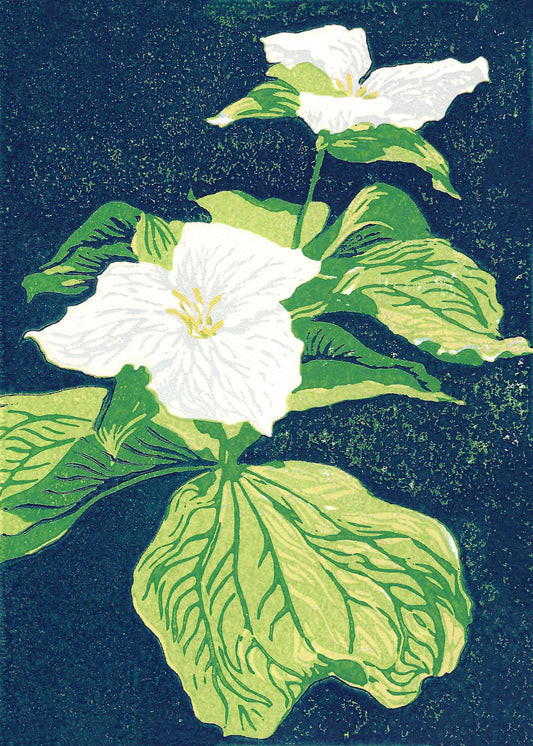 A multicolor block print of two trillium wildflowers with vibrant green leaves and a navy blue background by Peninsula Prints.