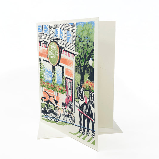 A casually elegant card featuring Mackinac Island art by Natalia Wohletz of Peninsula Prints titled Doud's Market #2.