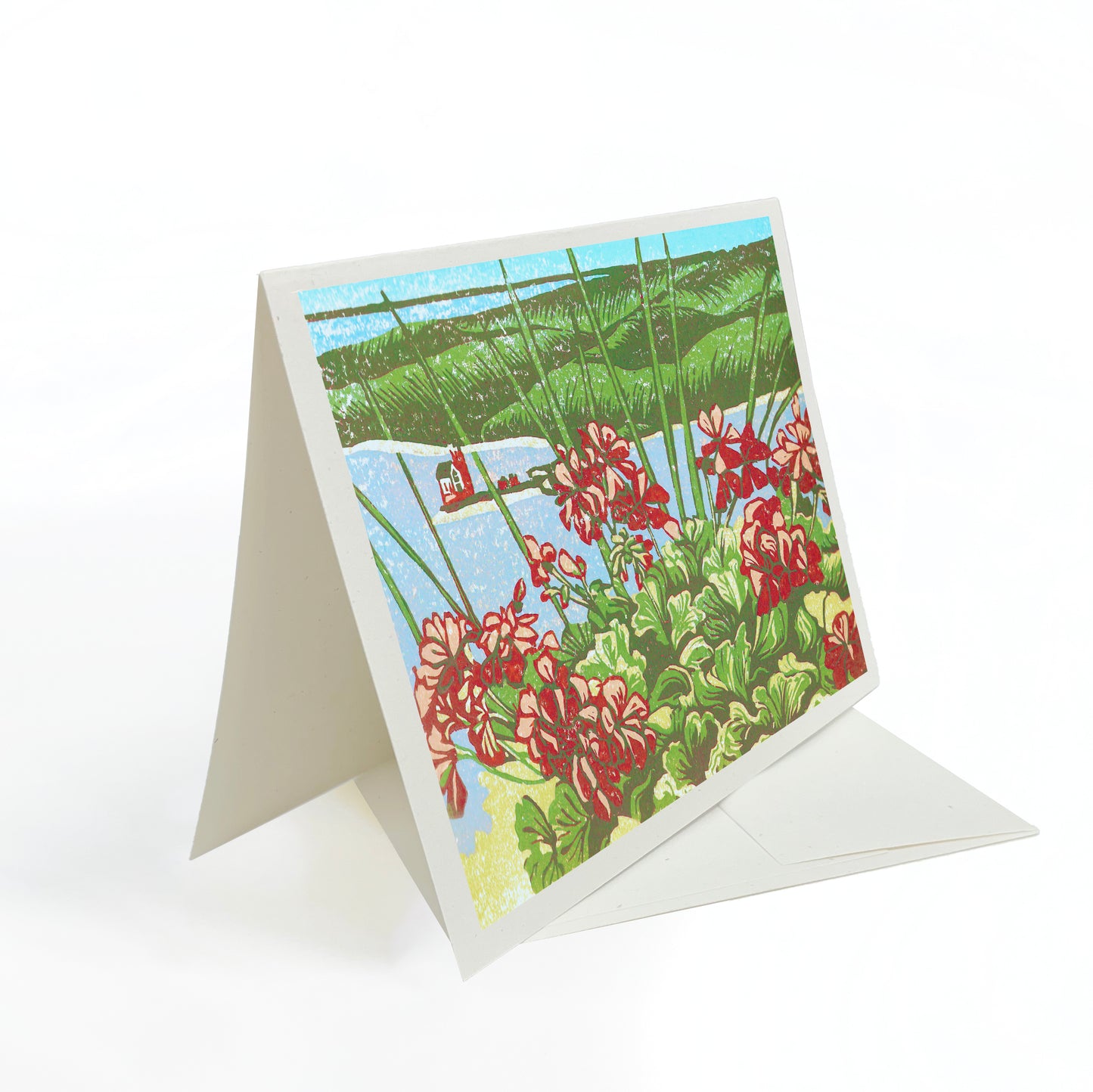 A casually elegant card featuring Mackinac Island art by Natalia Wohletz of Peninsula Prints titled Grand Geranium View.