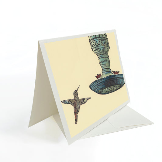A casually elegant card featuring Michigan wildlife art by Natalia Wohletz titled Hummingbird & Feeder.
