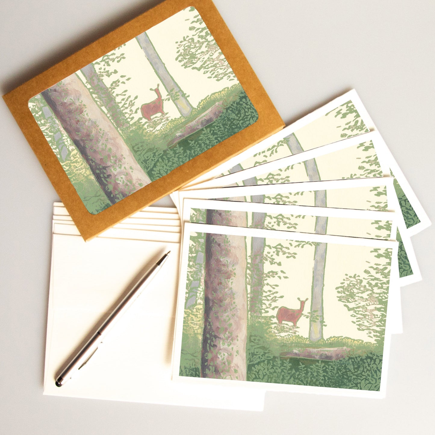 A casually elegant card set featuring Michigan wildlife art by Natalia Wohletz titled Deer in the Woods.