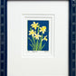 Daffodils is a 2"x3" four-color reduction block print inspired by the joyful spring blooms. Matted with a soft white double mat and framed in a lacquered blue frame with daisy embellishments.