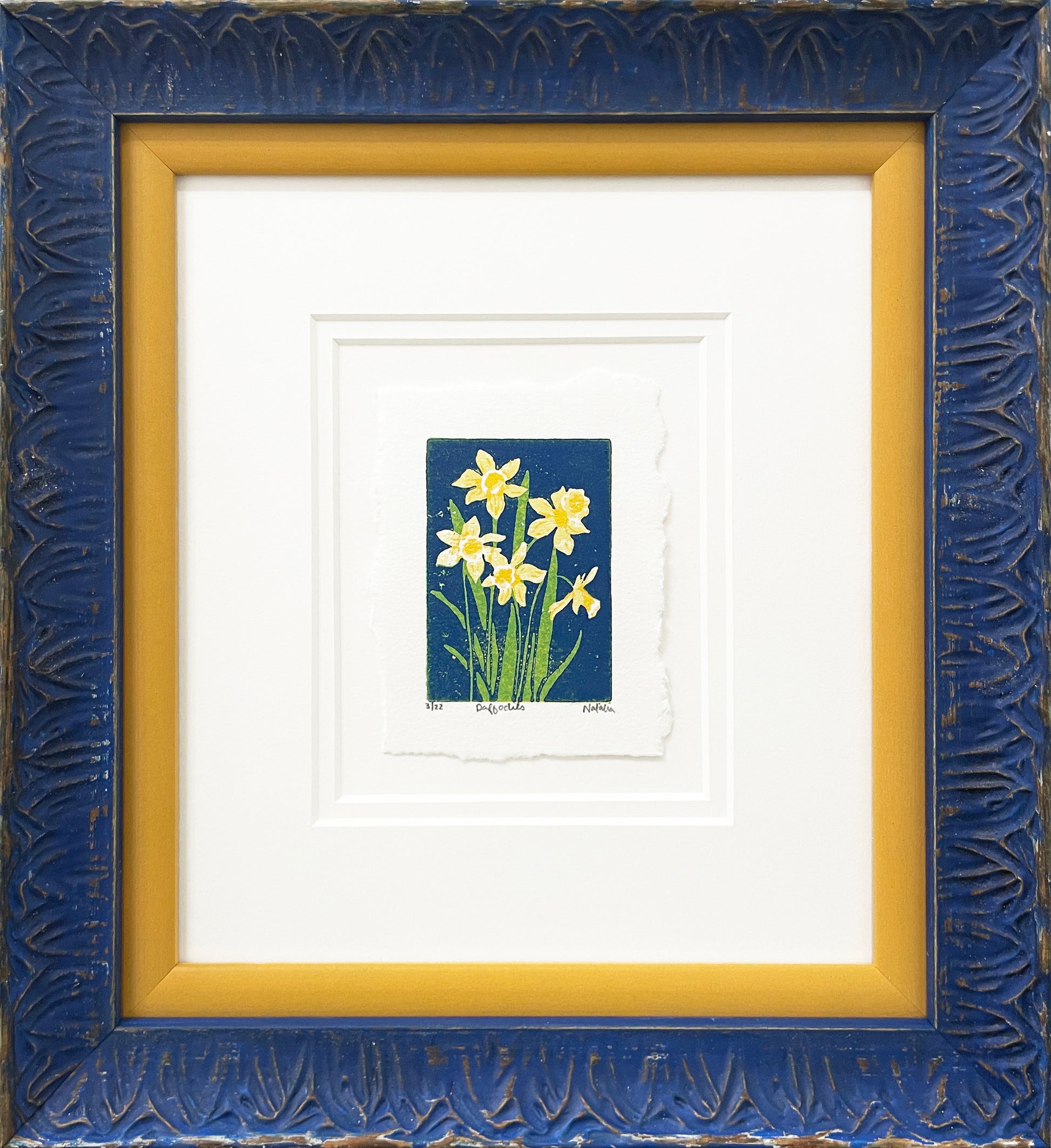 Daffodils is a 2"x3" four-color reduction block print inspired by the joyful spring blooms. Float mounted on soft white, then surrounded by a soft white double mat and framed in a stacked yellow, then blue frame with petal-shaped embossed detailing.