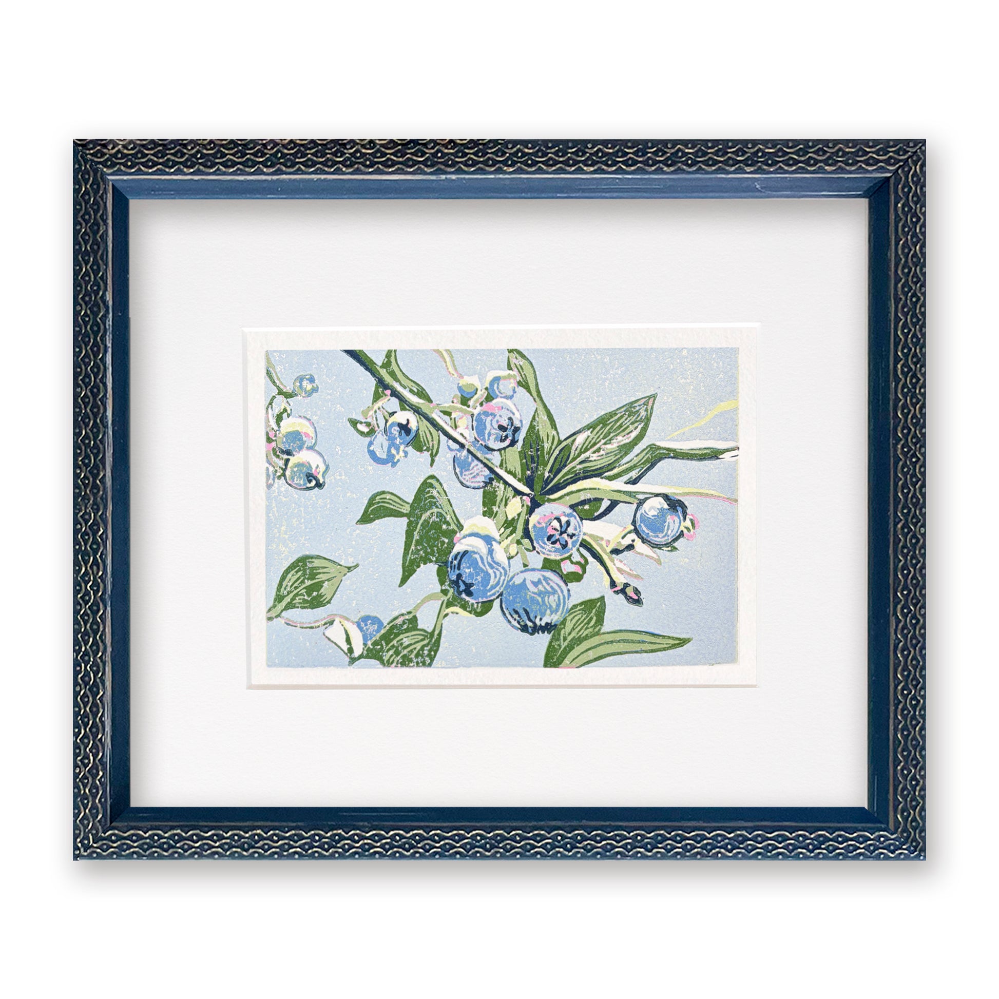 Framed artwork of blueberries and green leaves on a light blue background, with a navy blue frame.