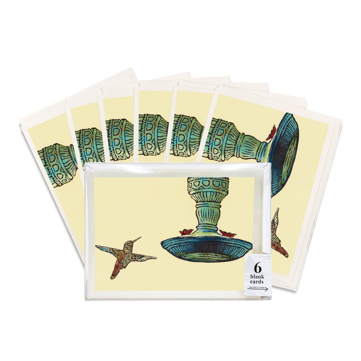 A boxed set of six casually elegant cards featuring Michigan wildlife art by Natalia Wohletz titled Hummingbird & Feeder.