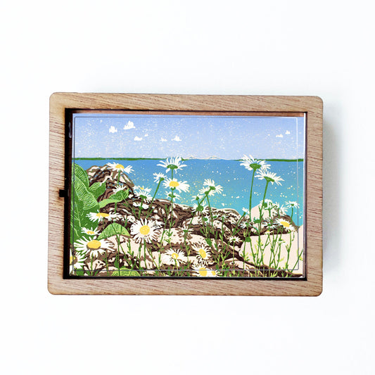 Decorative magnet featuring the block print, "Daisy Shore," by Peninsula Prints. The magnet has a protective clear coating and wooden frame.