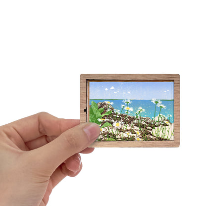 Decorative magnet featuring the block print, "Daisy Shore," by Peninsula Prints. The magnet has a protective clear coating and wooden frame.