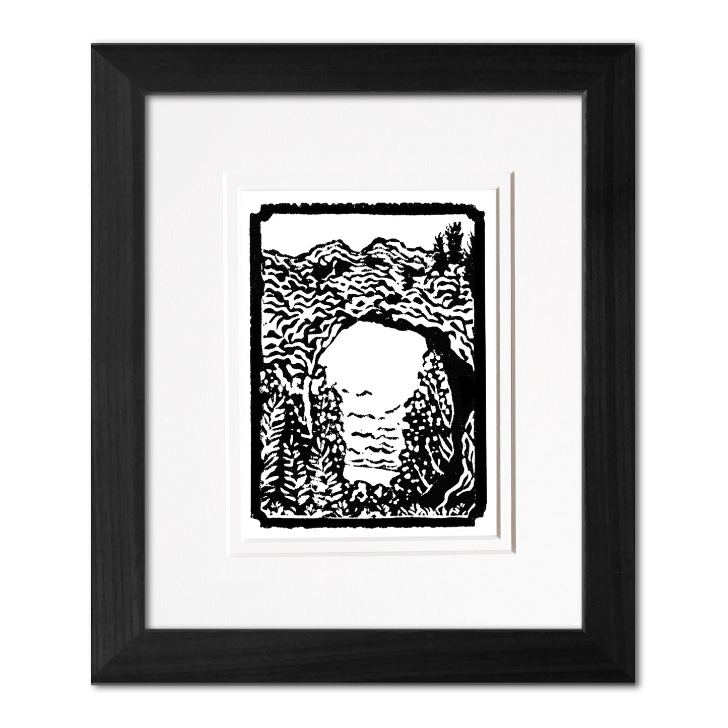 Mini Arch Rock 3"x4" one-color black and white block print of Arch Rock on Mackinac Island. Framed with a black woodgrain frame.