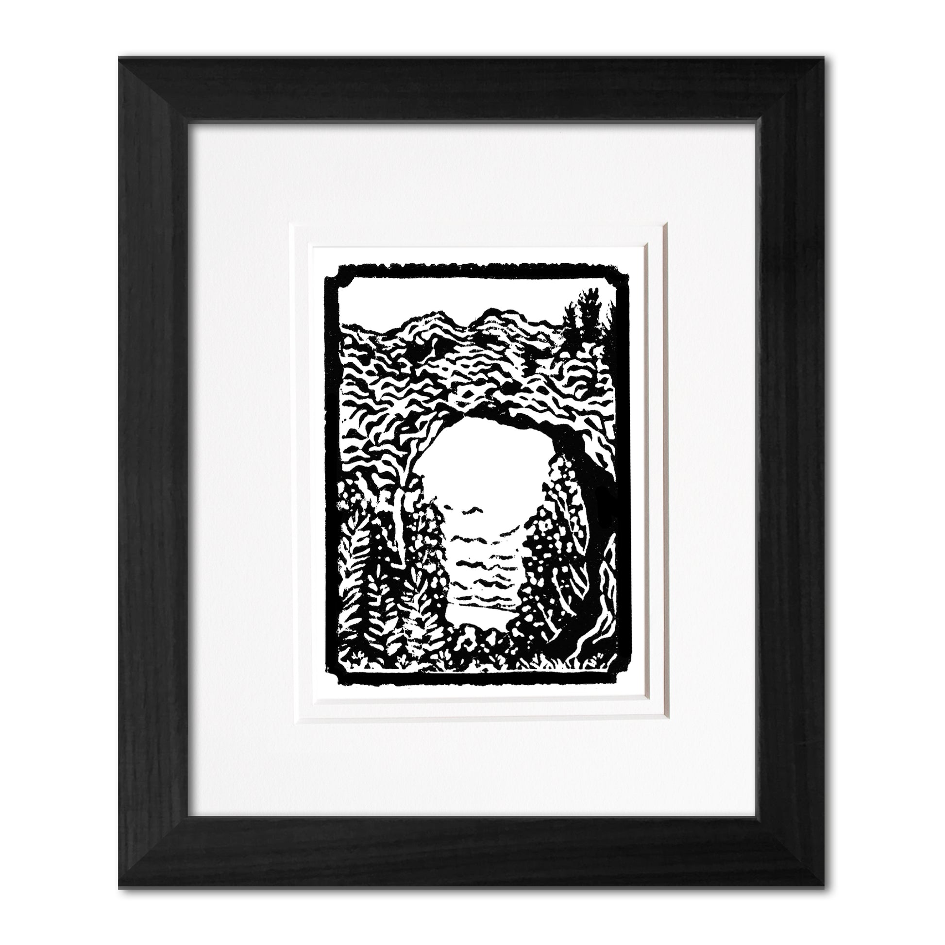Mini Arch Rock 3"x4" one-color black and white block print of Arch Rock on Mackinac Island. Framed with a black woodgrain frame.