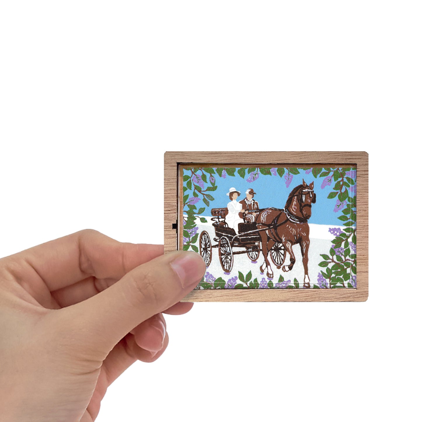 Decorative magnet featuring the block print, "Somewhere in Time Carriage Ride," by Peninsula Prints. The magnet has a protective clear coating and wooden frame.
