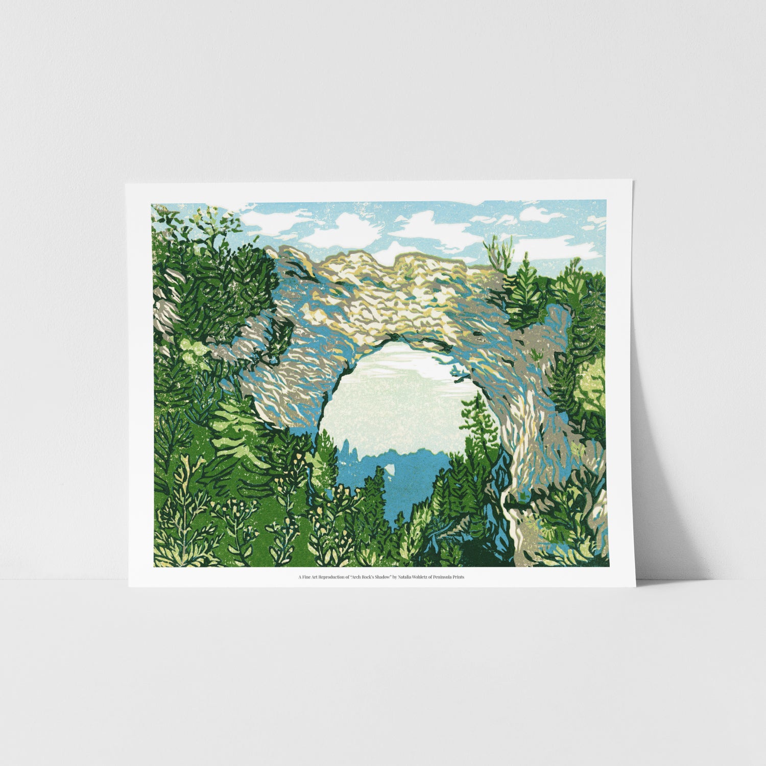 A fine art reproduction of "Arch Rock’s Shadow." an eight-color 10" x 8" print inspired by the most iconic rock formation on Mackinac Island: Arch Rock. The arch is an incredible sight any day, but on crisp, sunny days the light dances along its ridge as well as in the water beyond. 