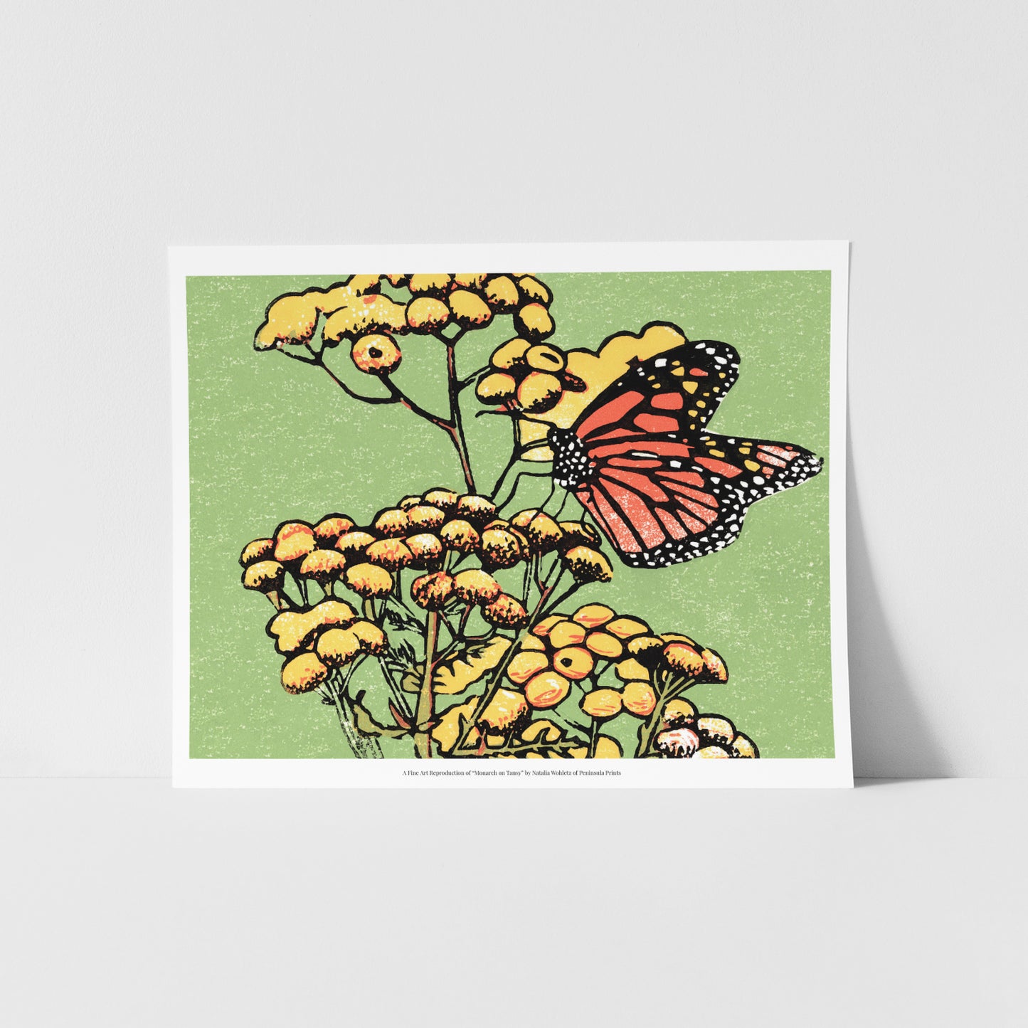 A fine art reproduction of "Monarch on Tansy," a four-color 8" x 6" block print featuring a monarch butterfly resting on common tansies. 