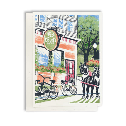 A casually elegant card featuring Mackinac Island art by Natalia Wohletz of Peninsula Prints titled Doud's Market #2.
