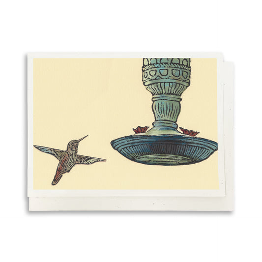 A casually elegant card featuring Michigan wildlife art by Natalia Wohletz titled Hummingbird & Feeder.