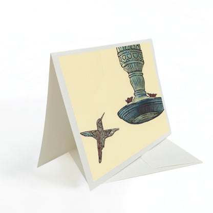 A casually elegant card featuring Michigan wildlife art by Natalia Wohletz titled Hummingbird & Feeder.