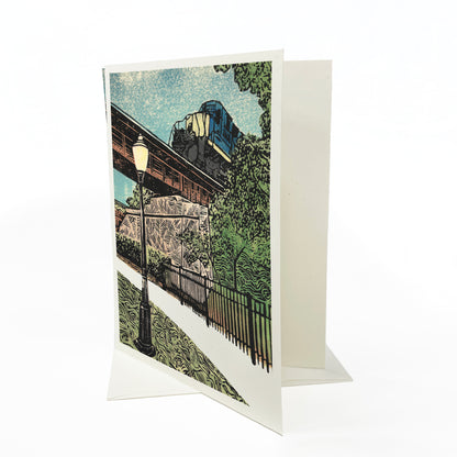 A casually elegant card featuring Milford, Michigan, art by Natalia Wohletz titled Milford Train.