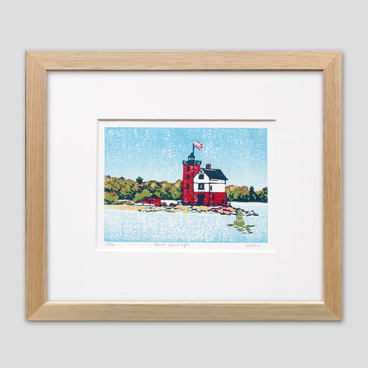Framed nautical art created by Natalia Wohletz of Peninsula Prints, Mackinac Island. Round Island Light is a four-color linoleum block print of one of Michigan's most beloved lighthouses. 
