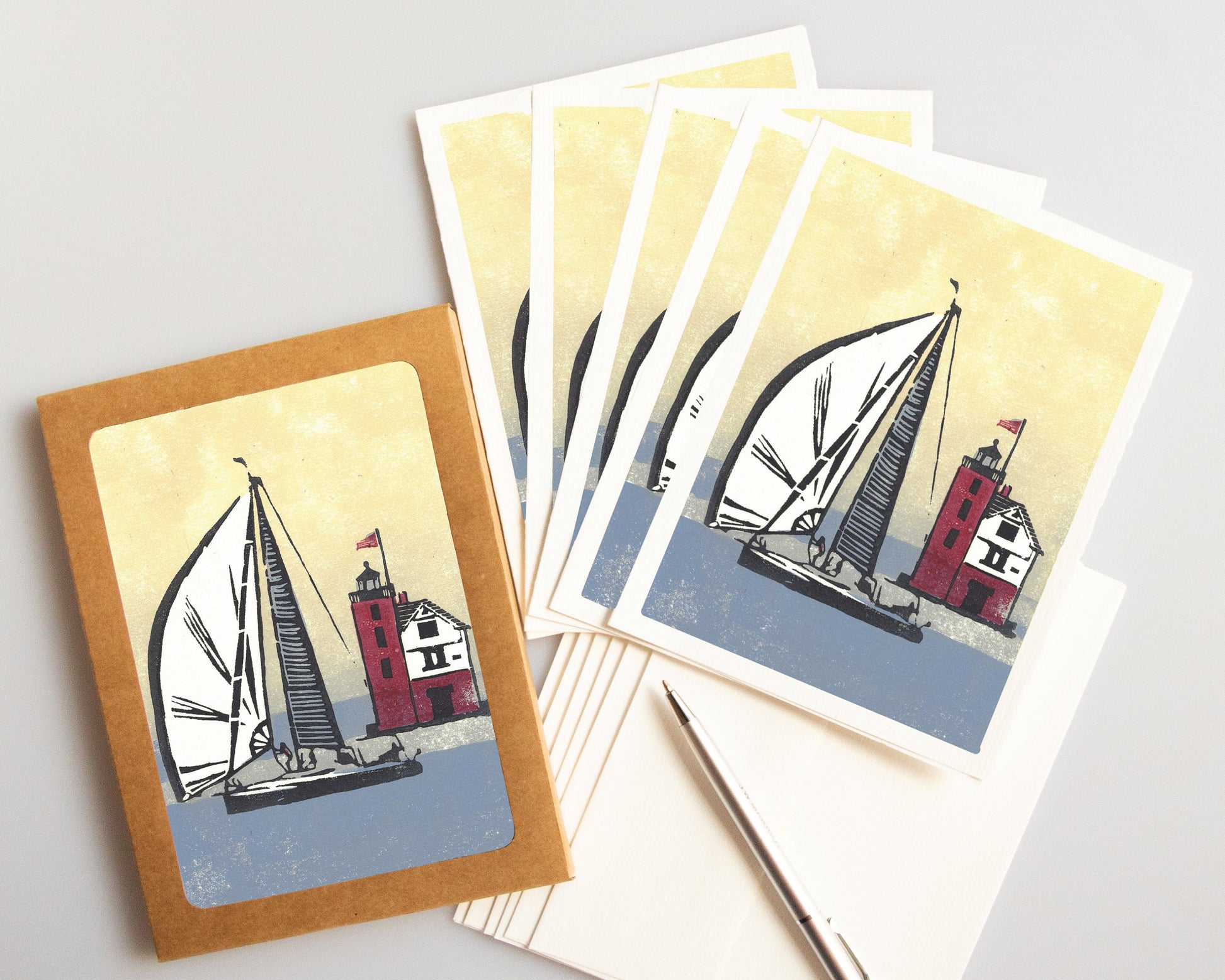 A casually elegant card featuring sailing and lighthouse art by Natalia Wohletz titled Foggy Finish.