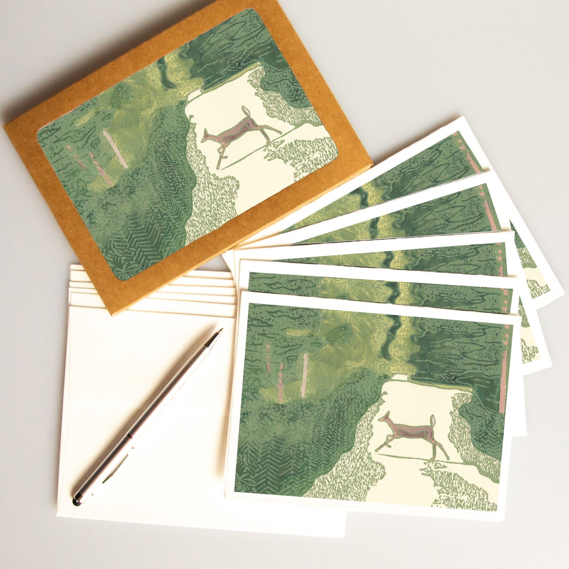 A casually elegant card set featuring Michigan wildlife art by Natalia Wohletz titled Doe Crossing.
